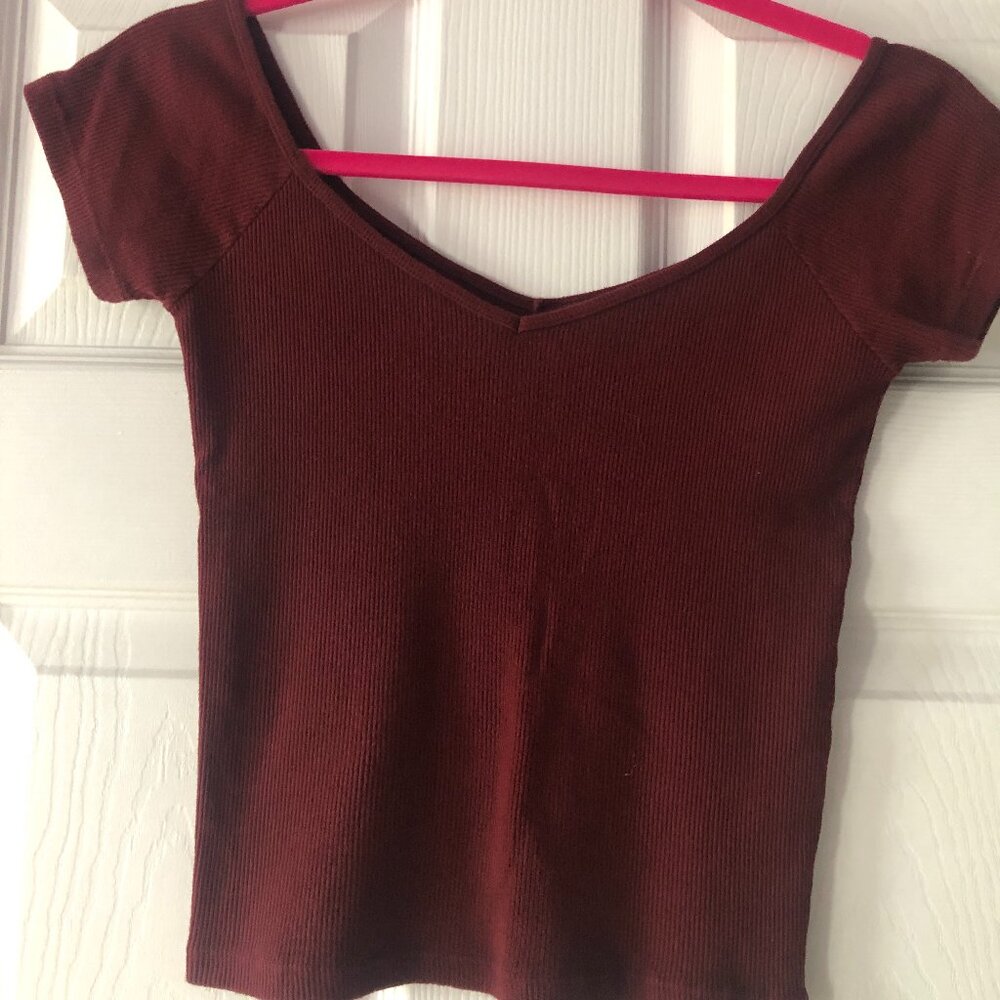 maroon shirt, off the shoulder